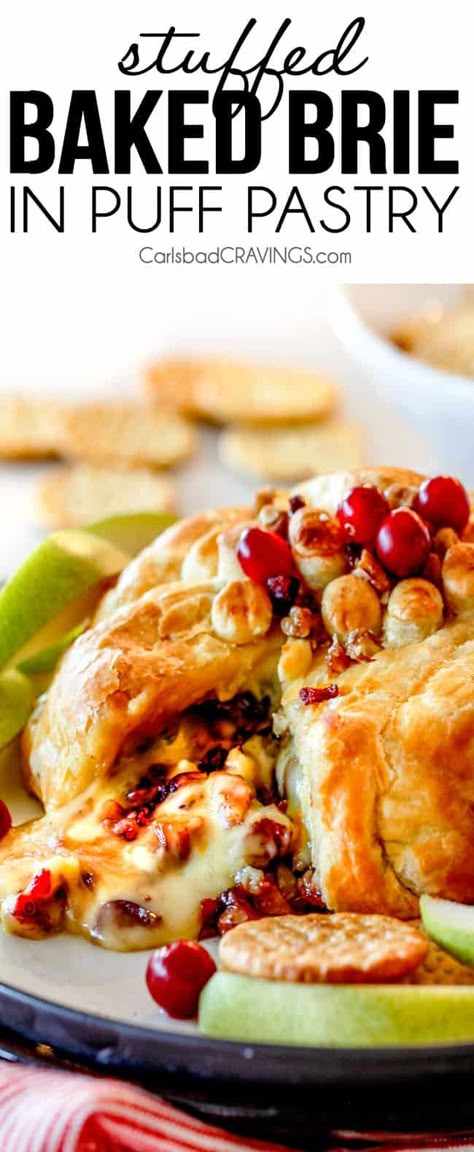 baked brie in puff pastry with with jam and cranberries oozing out of center Baked Brie Puff Pastry, Baked Brie In Puff Pastry, Brie In Puff Pastry, Party Nibbles, Baked Brie Recipes, Brie Puff Pastry, Puff Pastries, Brie Recipes, Carlsbad Cravings