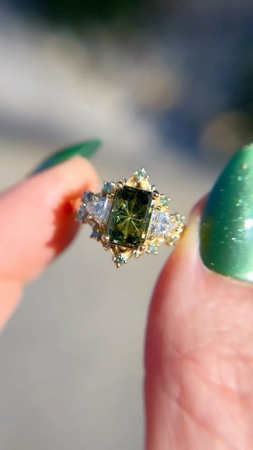 Uma | Engagement Rings on Instagram: "I realize I never share my larger briar setting, but this is a beautiful green Starbrite sapphire with lab diamond sides and mint diamond accents. The larger briar has an overall bigger appearance with larger sides/accents and slightly bigger 🍃 to even out the ratio of the larger stones.🖤" Green Diamond Ring, Green Engagement Rings, Green Diamond Rings, Paper Rings, Future Engagement Rings, Paper Ring, Vogue Dress, Green Rings, Ring Ideas