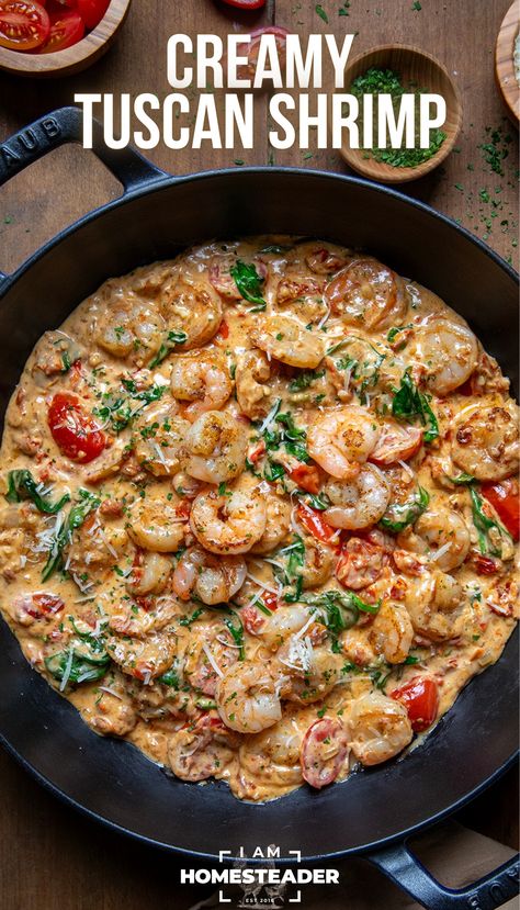 a black pan is full of creamy tuscan shrimp on a wooden board. Tuscan Shrimp And Spinach, Creamy Tuscan Shrimp, Shrimp Cream Sauce, Shrimp Spinach Pasta, Spinach Cream Sauce, Tuscan Shrimp, Seafood Dish Recipes, Grilled Shrimp Recipes, Sauteed Shrimp