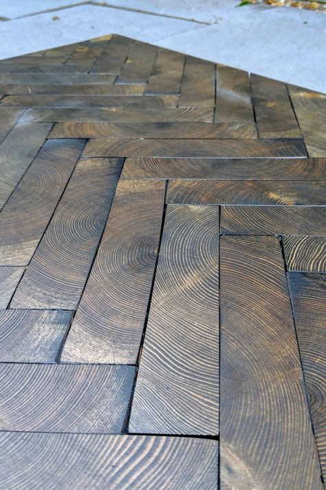 End grain flooring is a unique type of wood tile flooring. Traditional wood flooring is made of planks or block sawn lengthwise. The end grain flooring on the other hand is made of wooden blocks sawn crosswise to the grain. Onto the surface are plainly visible the annual rings of the tree. For this reason such wooden floors are unique and special. #WoodFloorsLondon #interiordesign #FinWood #CraftedForLife #WoodFloorDesign #EndGrainFlooring #endgrain #endgrainwoodenfloor #endgrainwood Wood Floor Design Ideas, End Wood Flooring, Unique Bedroom Flooring Ideas, Wood End Flooring, End Grain Wood Flooring, End Grain Flooring Diy, 2x4 Ends Flooring, Creative Wood Floors, Wood Block Floor