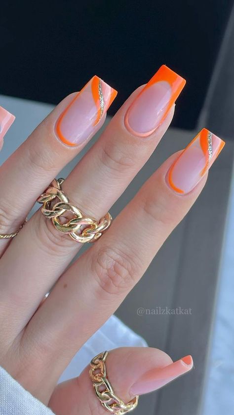 Two hands with long, almond-shaped nails, painted with a holographic polish that reflects a spectrum of colors, giving off a shiny, iridescent look. Summer Nails 2022 Trends, Nails 2022 Trends Summer, Unique Summer Nails, Orange Nail Ideas, Nail Ideas For Summer, Summer Nails 2022, Classy Almond Nails, Orange Acrylic Nails, Neon Yellow Nails