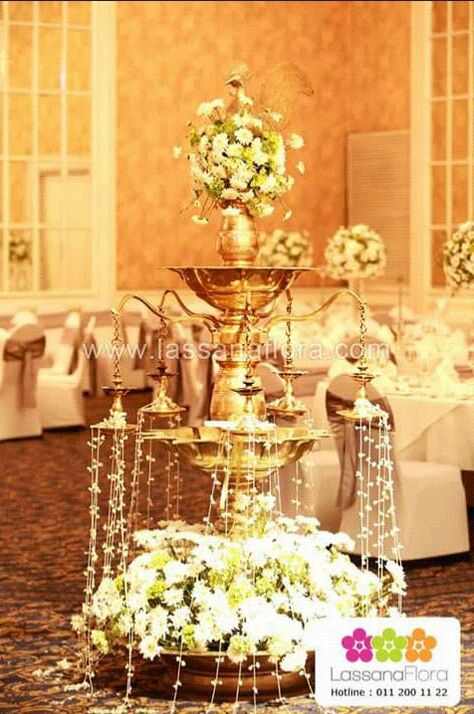 Sri lankan oil lamp. Wedding decor lassana flora. Jasmine, Hydrangea and mums Wedding Oil Lamp Decorations, Oil Lamp Wedding, Lamp Wedding Decor, Sri Lankan Wedding, Diya Decoration, Wedding Decors, Wedding Floral Centerpieces, Bridal Dress Design, Decorations Wedding