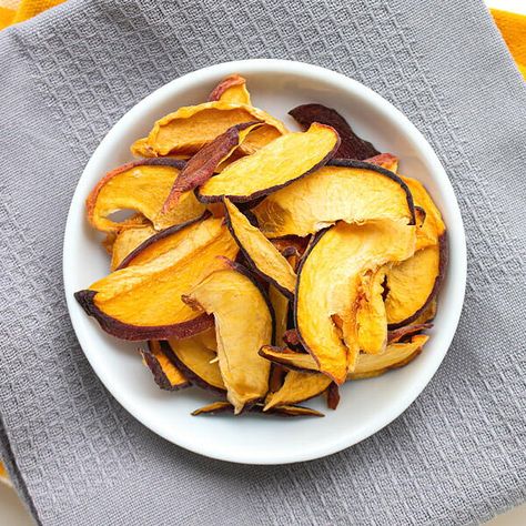 Did you know that you can dry peaches at home to make peach chips? These are not only delicious but also very healthy. They also make great back to school or after school snacks for kids. Besides, it's peach season and this is the best time to preserve your peaches. I share 3 tried and tested ways to dehydrate peaches at home. I also recommend and share the ones that I use and I talk about the pro and cons of each drying technique. These dried peaches will be food for at least 10 months if dried Healthy Summer Snacks, Dried Peaches, School Snacks For Kids, Healthy Casserole Recipes, Slow Cooker Times, Healthy Cake Recipes, Winter Cooking, Healthy Casseroles, Healthy Summer