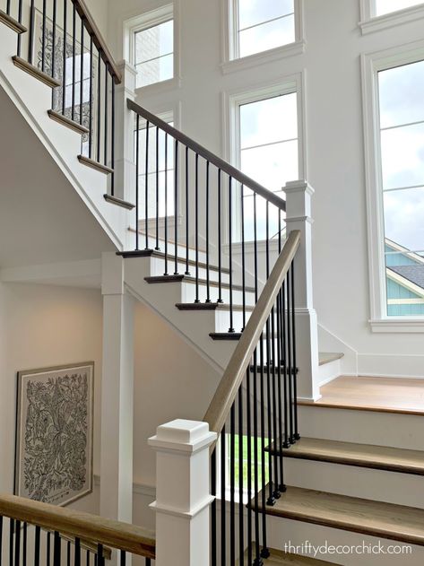 Staircase With Windows, Stair Railings Farmhouse, Black Spindles, Taupe Cabinets, Black Stair Railing, Wood Railings For Stairs, Black And White Stairs, Modern Home Tour, White Staircase