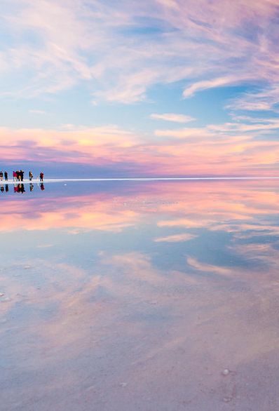 Salar de Uyuni, Bolivia  These 4,086 square miles in southwest Bolivia make up the world’s largest salt flat. The vast and incredibly flat plains and clear skies of Salar de Uyuni make it both one of the most famous “natural mirrors” on the planet, as well as an ideal altimeter calibration site for Earth observation satellites. 31 of 75 of the most colorful places in the world to go to. Salt Plains, Bolivia Salt Flats, Uyuni Salt Flats, Natural Mirrors, Uyuni Bolivia, Salt Flat, Bolivia Travel, Colorful Sky, Altimeter