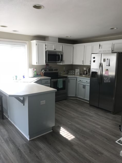 Gray floors, tuxedo cabinets Single Wide Kitchen Layout, Kitchen Ideas Mobile Home, Mobile Home Kitchen Cabinets Makeover, Trailer Kitchen Remodel Single Wide, Trailer Decorating Ideas Single Wide, Single Wide Kitchen Ideas, Tuxedo Cabinets, Trailer Kitchen Remodel, Trailer Remodel Single Wide