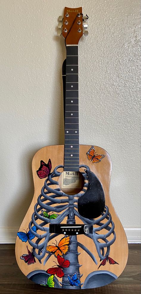 This guitar represents how nervous you are before stepping into the void. Butterflies flutter from your stomach to your heart. It was painted using acrylic, and finished September 2021. Painted Guitar Ideas, Painted Guitars Ideas, Painting On Guitar Ideas, Painted Guitar Acoustic, Guitar Painting Ideas, Painted Acoustic Guitar, Paint Guitar, Butterfly Guitar, Painting Guitar