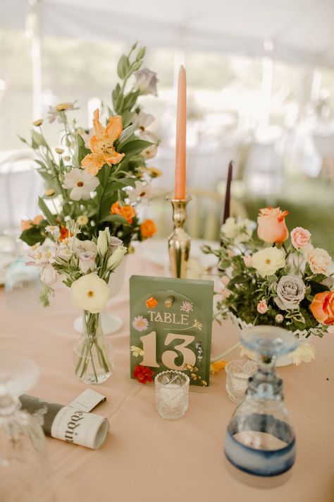 This 70s-inspired DIY Wedding at a Pennsylvania Mountain Hideaway Used Entirely Thrifted Decor! Pictures Of Couple Wedding Decor, Aisle Centerpiece Wedding, Wedding Decor September, Eclectic Centerpieces Wedding, Wedding Flower Reception, Mountain Spring Wedding, English Country Wedding Theme, June Garden Wedding, Whimsical Centerpiece Wedding