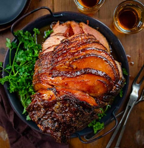 Make your holiday meal memorable with this Maple Bourbon Glazed Ham! Tangy Dijon mustard, sweet barbecue rub, and a rich bourbon maple glaze create a flavorful centerpiece! Ham Glaze Recipes, Bourbon Glazed Ham, Cooking Spiral Ham, Maple Bourbon Glaze, Barbecue Rub, Homestead Recipes, Ham Glaze Recipe, Spiral Ham, Bourbon Glaze