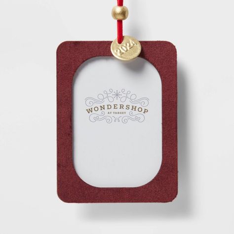 Create memorable moments by decorating your holiday tree with the Velvet 2024 Picture Frame Christmas Tree Ornament from Wondershop™. This rectangular picture frame Christmas tree ornament showcases a gold-tone charm with the year "2024" for a beautiful look. Crafted from wood and metal, it's easy to hang with the built-in loop, and you can either use it as is or insert a small photo to personalize the look. Welcome to the Wondershop™. Wooden Crates Christmas, Dino Decorations, Target Christmas, Frame Christmas, Candy Cane Christmas Tree, Retro Christmas Tree, Cone Christmas Trees, Metal Picture Frames, Fabric Pictures