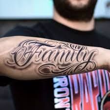 Top 250 Best Lettering Tattoos (October 2019) • Tattoodo Forearm Word Tattoo, Forearm Name Tattoos, Typographic Tattoo, Family Name Tattoos, Arm Tattoos Lettering, Family Tattoos For Men, Outer Forearm Tattoo, Names Tattoos For Men, Tattoo Lettering Styles