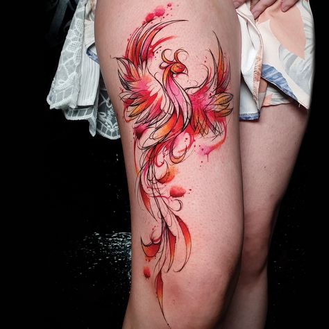 Vibrant red and orange inked phoenix tattoo on the thigh Colored Pheonix Tattoo, Colour Phoenix Tattoo Design, Pheonix Tattoo Watercolour, Pheonix Thigh Tattoos Women, Raising Phoenix Tattoo, Phoenix Calf Tattoo, Watercolour Phoenix Tattoo, Phoniex Thigh Tattoo Women, Neotraditional Phoenix Tattoo