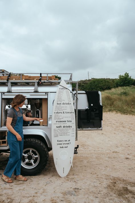 Wavi Coffee Coffee Van Surf Style in Landrover Defender 110 in Devon and Cornwall  with surfboard menu and woman making coffee Vw Coffee Van, Coffee Surf Shop, Coffee Van Ideas, Beach Coffee Shop, Landrover Defender 110, Trailer Exterior, Surf Bar, Devon Cornwall, Vans Aesthetic