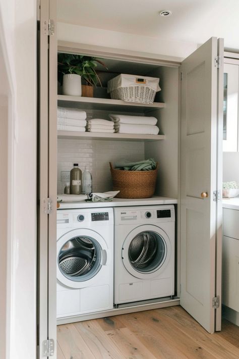 Laundry closet with washer, dryer, towels, and storage baskets. Laundry Corner Small Spaces, Small Kitchen Utility Ideas, Utility Small Room Ideas, Utility Room Cupboard Ideas, Walk Through Utility Room, Utility Extension Ideas, Utility Room Office, Bootility Room Layout, Pretty Utility Room