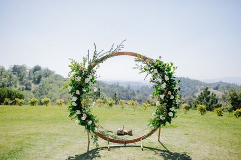 Love Grows Here. “Backdrops involving florals and greenery point to a versatile trend that isn’t going out of style, and mixing it up with a circle arch creates the perfect frame for photos,” Wedding Arch Circle, Gate Arch, Wedding Alter, Circle Arch, Wedding Alters, Moon Gate, Event Planning Tips, Floral Moon, Personal Celebration