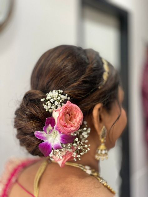 Flower Whisperer: Graceful Bun Hairstyles with a Hint of Floral Charm Marathi Bridal Hairstyles Indian, Flowers For Bun Hairstyle, Messy Bridal Bun Indian, Bride Mom Hairstyle Indian, Hairstyles For Mother Of The Bride, Bridal Bun Hairstyles Indian, Floral Bun Hairstyle, Flower Bun Hairstyle, Indian Bun Hairstyles