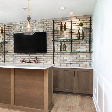 Bar goals achieved! 🍸✨⁠ ⁠ We love how our Bistro Counter to Wall Shelf looks in this beautiful basement bar design. The matte black finish perfectly complements the warm wood tones and ambient lighting.⁠ ⁠ Here's the best part: our shelves are fully customizable! Whether you're working with a cozy nook or a spacious entertainment area, we can fit into any space. We'll tailor the solution from size to finish to your unique needs.⁠ ⁠ Explore more shelving options on our website and let's bring ... Small Basement Bar, Goals Achieved, Basement Bar Design, Warm Wood Tones, Stone Accent Walls, Bar Shelf, Small Basements, Basement House, Entertainment Area