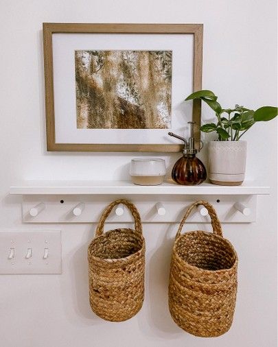 Hanging Baskets Entryway, Shelf With Hooks Entryway, Hanging Basket Entryway, Entryway Floating Shelf Decor, Hanging Baskets Nursery, Entry Shelf Decor, Peg Shelf Decor, Hanging Baskets On Wall, Entry Sideboard