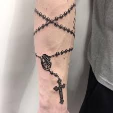 The 110 Best Christian Tattoos for Men  | Improb Rosary Tattoo Arm, Rosary Tattoo Wrist, Rosary Tattoo On Hand, Rosary Bead Tattoo, Cross Tattoo On Hand, Small Dope Tattoos, Traditional Hand Tattoo, Half Sleeve Tattoo Stencils, Tattoo Cross