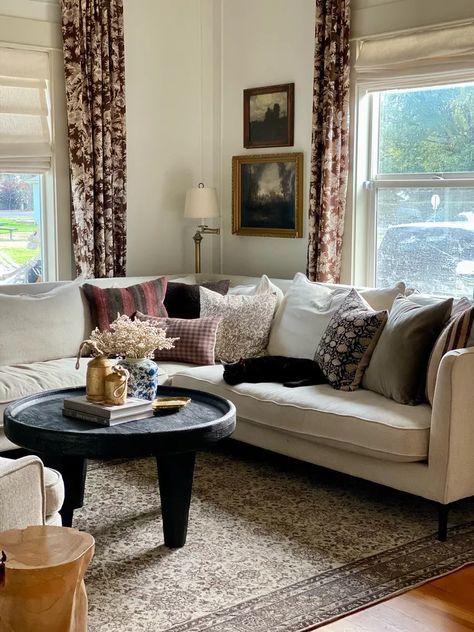 Window Behind Sectional, Corner Sofa In Front Of Window, Off Center Window Behind Couch, Scones Above Couch, Sectional Couch Styling, Couch Corner Decor, Light Behind Corner Sectional Couch, Corner Behind Sectional Decorating, Art Over Sectional Sofa