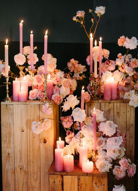 Pink Flowers Aesthetic Wedding, Pink Candles Table Decor, Pink Cocktail Party Decorations, Pink Flower Installation, Pink Wedding Ceremony Decor, Moody Pink Wedding, Pink Winter Wedding Theme, Red And Pink Decor, Pink Candles Wedding