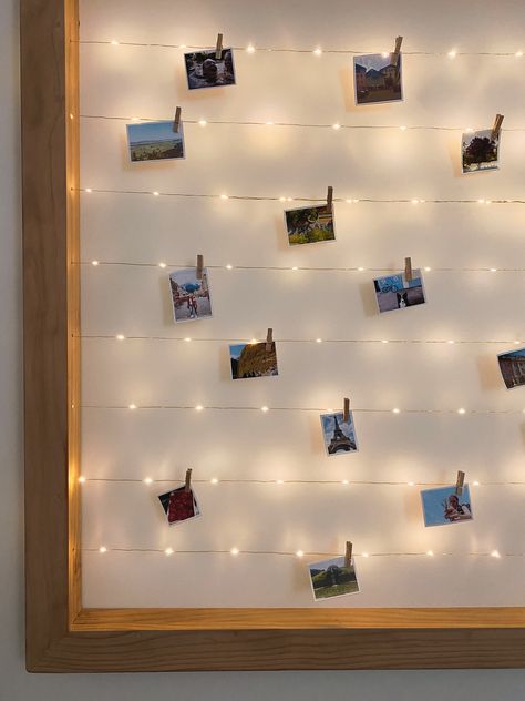 DIY pine frame with walnut stain, gold string lights, mini photos, mini wooden pegs Photo Peg Wall, Sticky Lights, Photo Hanging Ideas, Mermaid Centerpieces, Little Mermaid Centerpieces, Room String Lights, Diy Photo Wall, Dream Dressing Room, Peg Wall