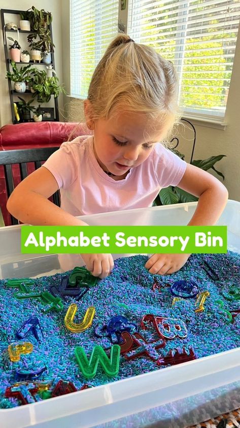 An alphabet sensory bin is as simple as *any* kind of letters (toys, puzzles, beads, etc) + *any* kind of filler (rice, water, beans, pasta, etc). Once it’s set up, you have endless ways to play! 7 of my favorite ways to use an alphabet sensory bin: Idea 1 – I Spy: Repeat the saying, “I spy with my little eye the letter [letter name],” and invite your child to find it. Idea 2 – Phonics Match: Say, “I’m looking for the letter that sounds like this [make a letter sound],” and invite your child Alphabet Sensory Bin, Make A Letter, How To Make Letters, Letter Sound, Rice Water, Sensory Bin, Letter Sounds, I Spy, Sensory Bins