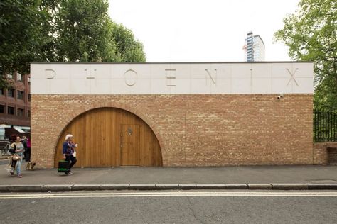 Office Sian adds brick and limestone building to London community garden Exterior Signage Entrance, Phoenix Garden, Garden Community, Exterior Signage, London Architecture, Stone Path, Brick Facade, Public Garden, Building Exterior