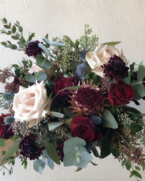 B O T A N Y {floral studio} on Instagram: “Bridal Bouquet with Baccara roses, Quicksand roses, black scabiosa, mixed eucalyptus, eryngium thistle, red skimmia, and more.” Black Baccara Rose Bouquet, Black Rose Bridal Bouquet, Scabiosa Bouquet, Thistle Flower Arrangement, Scottish Thistle Bouquet, Black Scabiosa, Thistle Wedding Flowers, Thistle Bouquet Wedding, Black Baccara Roses