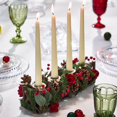 Use mismatched plates for a more relaxed vibe, and maybe a place card tied with twine around each napkin. Christmas Tea Light Holders, Candles Display, Long Candle Holder, Christmas Tea Light Holder, Christmas Dining Table Decorations, Long Candle, Yule Crafts, Yule Logs, Christmas Roses