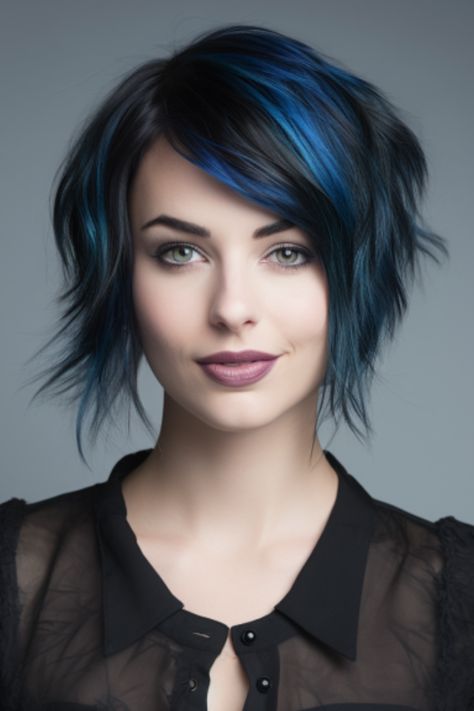 If you’re looking for a punk-inspired style go for a pitch-black bixie haircut with electric blue streaks. The black base provides sleekness while the electric blue streaks add an element of surprise. Click here to check out more trending bixie haircut ideas for 2023. November Hair Color, Creative Hair Color Short, Blue Bob Hair, Punk Haircuts, Blue Tips Hair, Blue Balayage, Asymmetrical Haircuts, Bixie Haircut, Short Blue Hair