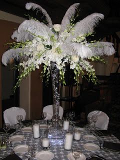 Centerpieces With Feathers, Feather Centerpiece Wedding, Lily Centerpieces, Ostrich Feather Centerpieces, Flowers And Feathers, Green Centerpieces, Feather Centerpieces, White Centerpiece, Gatsby Theme