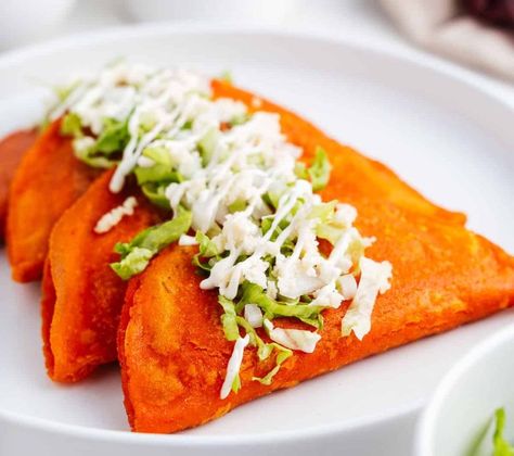 Enchiladas Potosinas, Mexican Crema, Tortilla Press, Serrano Pepper, Spicy Salsa, Cotija Cheese, Green Planet, Shredded Lettuce, Roma Tomatoes