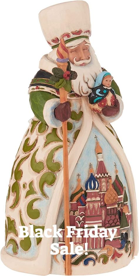 From Enesco’s Jim Shore Heartwood Creek Collection Intricately sculpted stone resin Santa Russian Santa holds a Russian doll and staff while displaying a quaint scene of St. Basil's Cathedral Sculpted stone resin with hand-painted features 7-inch (17.8 cm) height #ad Russian Santa, Christmas Around The World, Resin Figurine, St Basil's, Disney Traditions, Santa Figurines, Jim Shore, Christmas Travel, Decor Figurines