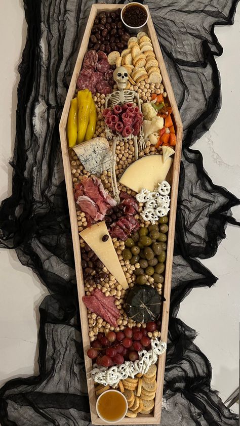 2023 Halloween Party, Coffin Cheese Board, Spooky Dinner Party Food, Coffin Shaped Charcuterie Board, Bougie Halloween Party, Goth Charcuterie Board, Halloween Bookclub Ideas, Halloween Board Night, Skeleton Food Display