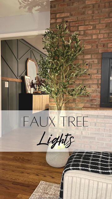 Elisa | HOME DIY, SOME DECOR on Instagram: "Faux Tree Lights! Look how easy it is to make your home look cozier at night!! I added some lights to my faux tree and it turned out so good. We like to turn it on when we are watching a movie at night. I got this idea from @the_avantgarde_ . . #interiordesign #interiør #interior #monochromehome #homereno #interiordesign #blackinterior #whiteinterior #diyhome #minimalism #softminimalism #neutralstyle #scandinavianhome #homedesign #ａｅｓｔｈｅｔｉｃ #interi Indoor Tree Lighting, Lighted Trees Indoor, Fake Tree Decor Living Room, Tree Uplighting, Tree Interior, Light Up Tree, Indoor Tree, Watching A Movie, Prelit Tree