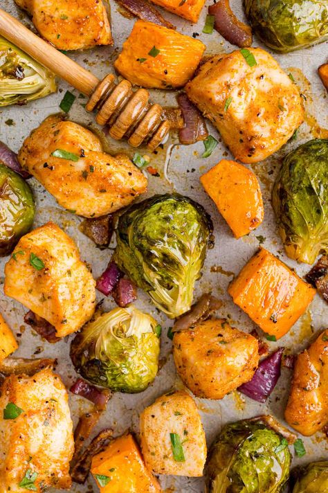 You'll love this hot honey chicken sheet pan dinner with roasted chicken, Brussels sprouts, and sweet potatoes, dressed up with spicy hot honey. One pan and lots of delicious eating! Chicken Sweet Potatoes Brussel Sprouts, Stuffed Chicken Sheet Pan Dinner, Sheet Pan Hot Honey Mustard Chicken And Brussel Sprouts, Chicken Sweet Potato Brussel Sprouts, One Pan Chicken And Sweet Potatoes, Brussel Sprouts And Sweet Potato Recipe, Chicken And Brussel Sprouts, Chicken Brussels Sprouts, Brussels Sprouts And Sweet Potatoes