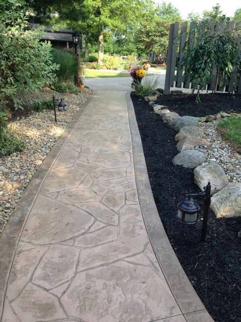 Walkway w rocks & mulch, stamped concrete. Stamped Concrete Sidewalk From Front Of Porch, Stamped Concrete Flagstone, Stamped Concrete Entryway Front Steps, Flagstone Walkways Paths, Stamped Concrete Walkways To Front Door, Stamped Sidewalk, Backyard Cement, Stamped Concrete Ideas, Porch Walkway