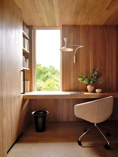 The office is wrapped floor to ceiling in white oak panels; the built-in  floating desk is made of the same material. Above the Perennials-upholstered Blu Dot chair is a Nemo sconce from Lumens. Floating Wood Desk Office, Notched Wood Desk, Bludot Nook Bed, Birch Wallpaper Office, Bludot Desk, Oak Beds, Floating Desk, Oak Panels, White Oak Floors