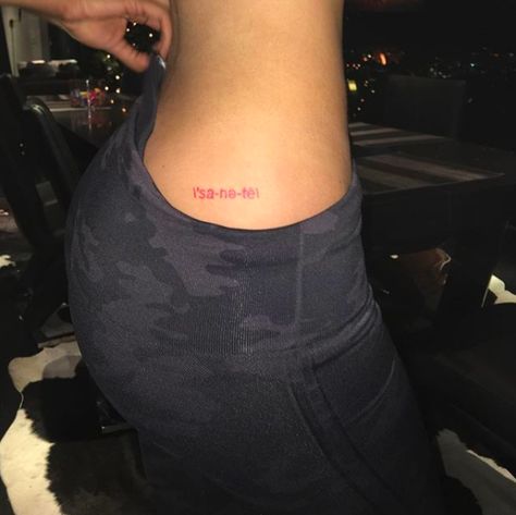 21 beautiful butt tattoos | Revelist Cheek Tattoo, Kylie Jenner's Tattoos, Wörter Tattoos, Story Tattoo, Bum Tattoo, Red Ink Tattoos, Red Tattoos, E Tattoo, Celtic Tattoos