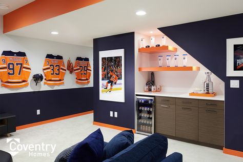 Coventry Homes Oilers Fan Cave - Uplands Showhome Oilers Man Cave, Oilers Basement, Jersey Presentation, Sports Room Man Cave, Man Cave Ideas Cheap, Hockey Man Cave, Cool Basement Ideas, Coventry Homes, Hockey Room