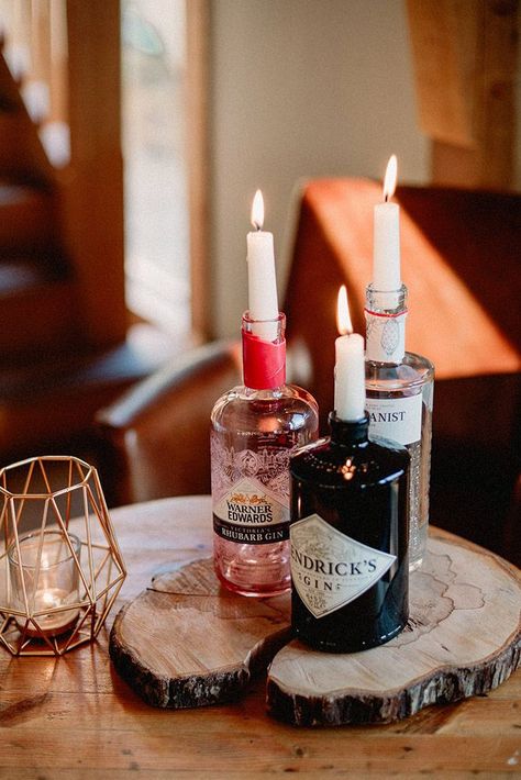 rustic wedding centerpieces glass wisky bottles with candles love luella photography Gin Bottle Candle, Gin Bottle Decoration, Gin Bottle Table Decorations, Gin Decorations, Gin Candle, Candle In Bottle, Candle In A Bottle, Gin Table, Candle Bottle