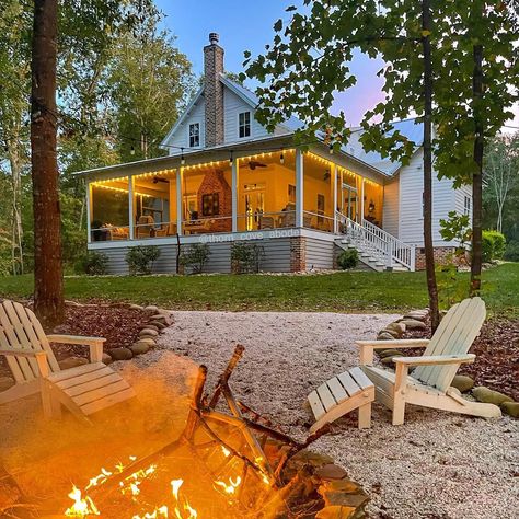 Bonfire nights are here. 🍁 What is your favorite way to make s’mores? I’m thinking a s’mores bar by the fire is in our future. 🤤 #farmhouse #bonfire #outdoorliving #farmhouselove #newoldhouse #historicallyinspired House Wrap Around Porch, Autumn House, Southern Porches, River Cottage, Porch Doors, Lakefront Property, Porch Rug, Lots Of Windows, S'mores Bar