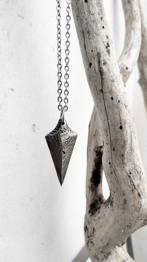 The arrowhead has been a powerful symbol in many great civilizations. Native Americans used to wear them as talismans in rituals, for protection, courage, strength and alertness. While the mighty Vikings would see the arrowhead as a for of protection both in defence and offence.

This pendant is completely handmade and one of a kind with great attention to detail. It is made using the lost wax technique. 
The chain is stainless steel.
Pendant size: 5×2,5cm
Chain: 50cm
By abyssjewelsmith Etsy Arrowhead Pendant, Self Defence, Earring Designs, Dec 12, Lost Wax, The Mighty, Designer Earrings, Handcrafted Jewelry, Vikings