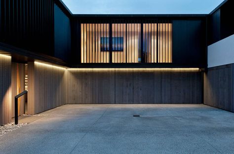 18 Inspirational Examples Of Modern Garage Doors // Made from the same panels as the rest of the bottom level, these garage doors are concealed from view. Rope Lighting, Modern Garage Doors, Outdoor Led Strips, Modern Garage, Contemporary Exterior, Wooden Front Doors, Led Strip Light, Rope Light, Strip Light