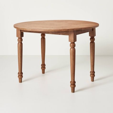 Add traditional charm to your dining setting with this Vintage Windsor Drop Leaf Round Dining Table from Hearth & Hand™ with Magnolia. Constructed with a lacquered stained rubberwood frame, this kitchen table showcases a round wood-finish top with four pedestal legs to create a warm, inviting look. This round dining table provides enough space to create seating for four — just pair it with matching chairs to create a coordinated dining setting. Hearth & Hand™ with Magnolia: Gather • Create • Enjoy Overall width: 44 inches Overall height: 30 inches Short leg distance: 23.5 inches Long leg distance: 34 inches Center width: 26 inches Leaf width: 9 inches Magnolia Furniture, Windsor Dining Chairs, Round Kitchen Table, Apartment Dining, Vintage Dining Table, Brown Floors, Brown Table, Small Dining Table, Drop Leaf Table