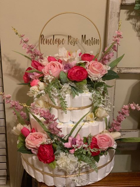 Floral baby shower diaper cake Beautiful Diaper Cakes, Flower Diaper Cake Ideas, Wildflower Baby Shower Theme Decor, Strawberry Diaper Cake, Rose Garden Baby Shower Theme, Floral Diaper Cake, Vintage Floral Baby Shower Ideas, Wildflower Diaper Cake, Blooming Baby Shower Theme