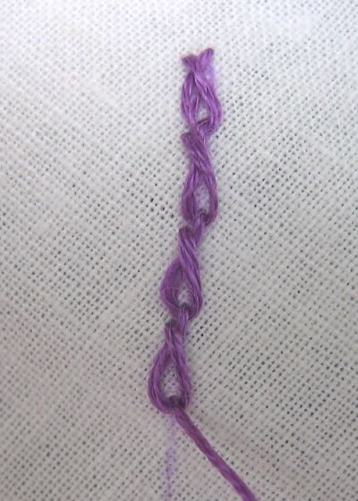 Twisted chain stitch  is a variation of the basic chain stitch that we learned earlier (see Lazy Daisy  which is really a detached chain sti... Chain Stitch Hand Embroidery, Twisted Chain Stitch, Detached Chain Stitch, Stitch School, Twisted Chain, Free Motion Embroidery, Basic Embroidery Stitches, Hand Embroidery Tutorial, Needlepoint Stitches