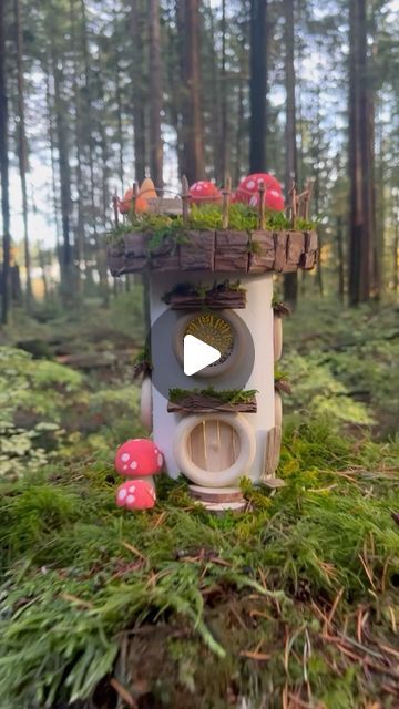 Maryinthefairyland on Instagram: "How about a fairy house with a solar roof?  For those eager to embark on a creative journey, I am considering creating a DIY kit with all the essentials. Please let me know if you are interested, so I can gauge the demand and determine how many kits to produce. Thank you for expressing your interest by subscribing here: https://t.ly/hjFuD  Materials used: clay, recycled jar, wood rings, wood cutouts, solar jar light, wood dowel, bark, twig, moss, hemp string, school- and hot glue. All the products used are conveniently showcased on my Amazon storefront. Find the link in my BIO for more details.  It’s important to note that the fairy house is a temporary installation, and I don’t leave them permanently in place.  #fairyland #fairyvillage #fairyforest #whims Temporary Installation, Recycled Jars, Fairy Village, Fairy Jars, Solar Roof, Clay Houses, Jar Lights, Amazon Storefront, Wood Rings