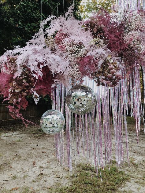 Disco balls make every party shine a little brighter! Add a textured purple and pink floral installation with a little sparkle from disco balls, and it’s guarenteed to be the talk of the party! #kaceymusgraves #discoball #cowboy #cowgirl #spacecowboy #floralinstallation #florals Disco Ball Installation Wedding, Disco Ball Installation, Disco Garden Party, Simple Floral Centerpieces, Peach Wedding Decorations, Disco Bride, Ball Installation, Disco Ball Decorations, Pink Purple Wedding